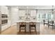 Bright, modern kitchen featuring a large island, stainless steel appliances, and a stylish dining area at 1024 Sagegrass St, Summerville, SC 29485