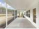 Large screened-in porch with a scenic view of the lake and backyard at 1024 Sagegrass St, Summerville, SC 29485