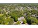 Aerial view of houses nestled among lush trees and a nearby pond at 106 Pickering Ln, Charleston, SC 29414