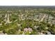 Aerial view of houses nestled among lush trees and a nearby pond at 106 Pickering Ln, Charleston, SC 29414