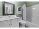Bathroom with a white vanity, toilet, and shower/tub combination, providing functionality and style at 106 Pickering Ln, Charleston, SC 29414