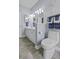 Well-lit bathroom with a white toilet, storage cabinet, and towel rack for convenience at 106 Pickering Ln, Charleston, SC 29414