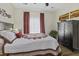 Cozy bedroom with wood floors, ceiling fan, and large dresser at 106 Pickering Ln, Charleston, SC 29414