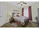 Cozy bedroom with wood floors, ceiling fan, and natural light at 106 Pickering Ln, Charleston, SC 29414