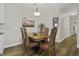 Bright dining room featuring wood floors and an elegant chandelier at 106 Pickering Ln, Charleston, SC 29414