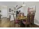 Dining area with hardwood floors, an ornate wood table, and chairs adjacent to kitchen at 106 Pickering Ln, Charleston, SC 29414