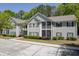 Charming two-story condo complex with gray siding, black shutters, and screened in porches at 106 Pickering Ln, Charleston, SC 29414