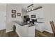 Well-lit kitchen features white cabinets, granite countertops, and modern appliances at 106 Pickering Ln, Charleston, SC 29414