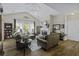 Spacious living room featuring hardwood floors, vaulted ceilings, and a comfortable brown leather sofa at 106 Pickering Ln, Charleston, SC 29414