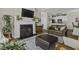 Inviting living room featuring fireplace and an open floor plan to the updated kitchen at 106 Pickering Ln, Charleston, SC 29414