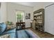 Bright office space with a wooden desk, shelving, and comfortable seating for productivity at 106 Pickering Ln, Charleston, SC 29414