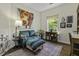 Cozy sitting room with a colorful painting, comfortable seating, and a charming decor at 106 Pickering Ln, Charleston, SC 29414