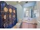 Charming bathroom featuring a vanity, toilet, and celestial-themed shower curtain at 109 E Hartwick Ln, Goose Creek, SC 29445