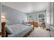 Cozy bedroom with two windows, a single bed, and neutral carpeting at 109 E Hartwick Ln, Goose Creek, SC 29445