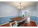 Dining room features a wooden table and bench, complemented by soft blue walls at 109 E Hartwick Ln, Goose Creek, SC 29445