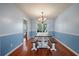 Comfortable dining room with natural light, a wood table, and simple, elegant decor for Gathering gatherings at 109 E Hartwick Ln, Goose Creek, SC 29445