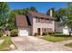 Charming two-story home with red shutters, attached garage, and well-manicured lawn at 109 E Hartwick Ln, Goose Creek, SC 29445