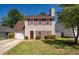 Charming two-story home with red shutters, attached garage, and well-manicured lawn at 109 E Hartwick Ln, Goose Creek, SC 29445