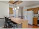 Open concept kitchen with an island, stylish pendant lighting, and stainless steel appliances at 109 E Hartwick Ln, Goose Creek, SC 29445