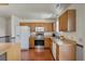 A kitchen featuring wood cabinets, stainless steel appliances, and laminate countertops for a functional design at 109 E Hartwick Ln, Goose Creek, SC 29445
