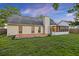 Backyard view showcasing a cozy deck and enclosed porch, perfect for outdoor entertaining at 109 Red Cypress Dr, Goose Creek, SC 29445