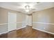 Spacious bedroom with two closets, hardwood floors, ceiling fan and neutral paint at 109 Red Cypress Dr, Goose Creek, SC 29445