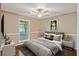 Comfortable bedroom with a ceiling fan, queen bed, and large window with lots of light at 109 Red Cypress Dr, Goose Creek, SC 29445