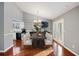 Formal dining area with elegant chandelier, table setting, and French doors at 109 Red Cypress Dr, Goose Creek, SC 29445