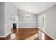 Bright dining room with open access to the kitchen, laminate flooring, and chandelier at 109 Red Cypress Dr, Goose Creek, SC 29445