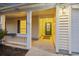 Inviting front porch with warm lighting and charming details welcomes you home at 109 Red Cypress Dr, Goose Creek, SC 29445
