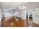 Open-concept living room with kitchen access and laminate floors at 109 Red Cypress Dr, Goose Creek, SC 29445