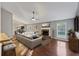 Staged living room features a cozy fireplace, large windows, and stylish decor at 109 Red Cypress Dr, Goose Creek, SC 29445