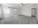 Large main bedroom with a tray ceiling, walk-in closet, and adjacent ensuite bathroom at 109 Red Cypress Dr, Goose Creek, SC 29445