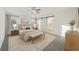 Bright main bedroom featuring a tray ceiling, barn door to the bath, and neutral colors at 109 Red Cypress Dr, Goose Creek, SC 29445