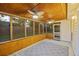 Cozy screened-in porch with wood ceiling, ceiling fans, and backyard views at 109 Red Cypress Dr, Goose Creek, SC 29445