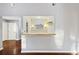 Unique wet bar area with tile countertop, decorative lighting, and pass-through to living area at 109 Red Cypress Dr, Goose Creek, SC 29445
