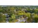 Scenic aerial view of a neighborhood featuring lush trees, houses, and a waterfront view at 1106 Meadowcroft Ln, Mount Pleasant, SC 29464