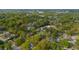 This aerial image shows a serene neighborhood with mature trees shading single-Gathering homes, some with pools at 1106 Meadowcroft Ln, Mount Pleasant, SC 29464