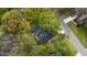 Aerial view of the property showcasing the house, mature trees, and surrounding neighborhood at 1106 Meadowcroft Ln, Mount Pleasant, SC 29464