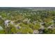 This aerial view displays lush, mature trees and the streets and homes of a charming residential neighborhood at 1106 Meadowcroft Ln, Mount Pleasant, SC 29464