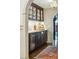 Stylish bar area with a sink, dark wood cabinets, and marble countertops at 1106 Meadowcroft Ln, Mount Pleasant, SC 29464