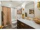 Stylish bathroom with a marble vanity, tub-shower combo, and chic gold fixtures at 1106 Meadowcroft Ln, Mount Pleasant, SC 29464