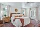 Inviting bedroom with large windows, ceiling fan, and hardwood floors at 1106 Meadowcroft Ln, Mount Pleasant, SC 29464