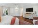 Bright bedroom featuring a ceiling fan, decorative rug, and hardwood floors at 1106 Meadowcroft Ln, Mount Pleasant, SC 29464