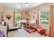 Charming bedroom featuring bunk beds, floral accents, and natural light from the windows at 1106 Meadowcroft Ln, Mount Pleasant, SC 29464