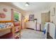 Bright bedroom features a bunk bed, pink walls, dresser, and sun-lit windows at 1106 Meadowcroft Ln, Mount Pleasant, SC 29464