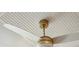 Close-up of a modern ceiling fan with white blades against a bright, wooden-planked ceiling at 1106 Meadowcroft Ln, Mount Pleasant, SC 29464