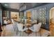 Elegant dining room with dark walls, statement wallpaper, and a grand table set in a refined space at 1106 Meadowcroft Ln, Mount Pleasant, SC 29464