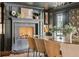 Dining room features a fireplace, elegant lighting, and neutral decor at 1106 Meadowcroft Ln, Mount Pleasant, SC 29464