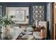 Comfortable dining space with decorated walls, accent chair, and natural light at 1106 Meadowcroft Ln, Mount Pleasant, SC 29464